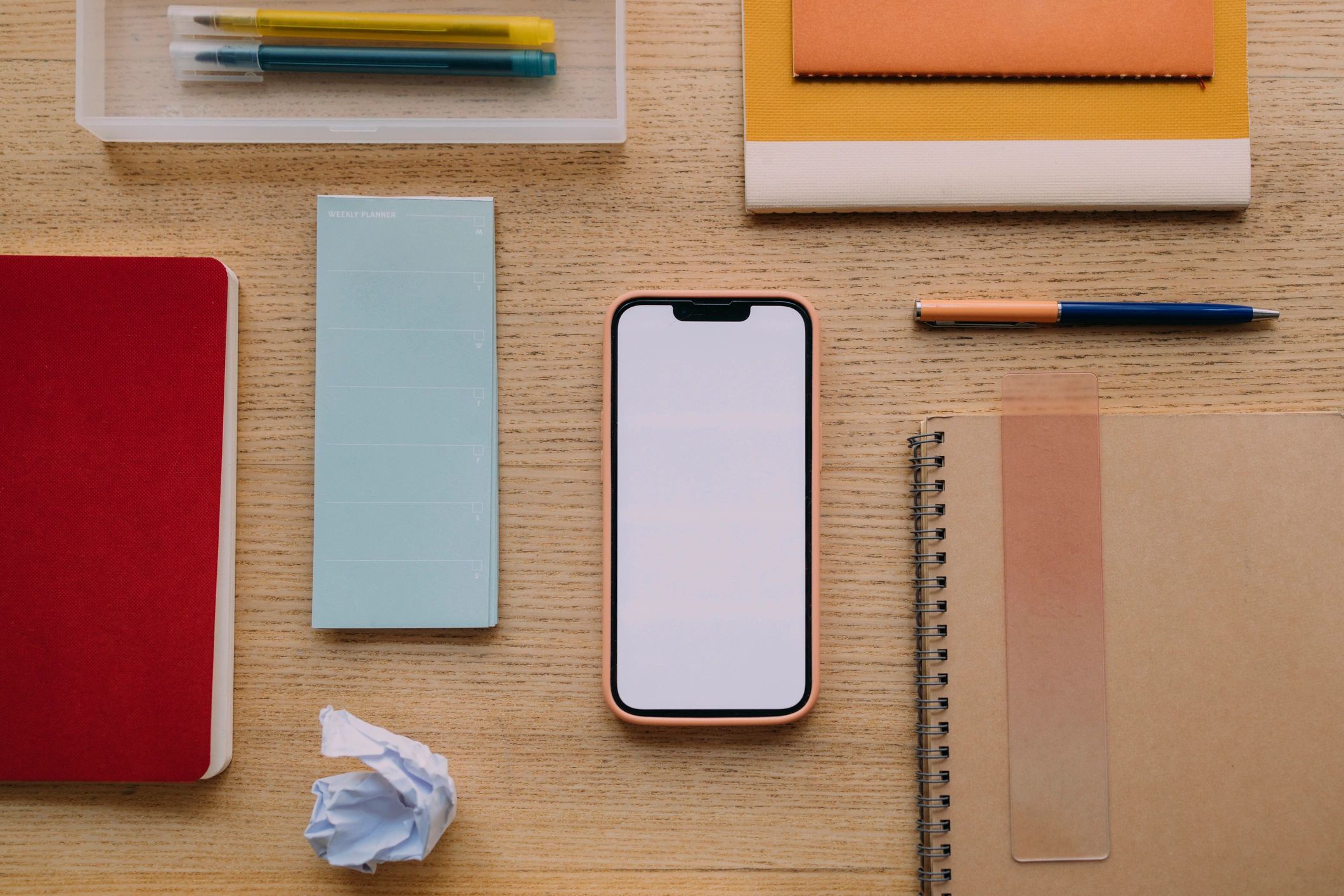 Flat lay of smartphone and office supplies for social media content planning