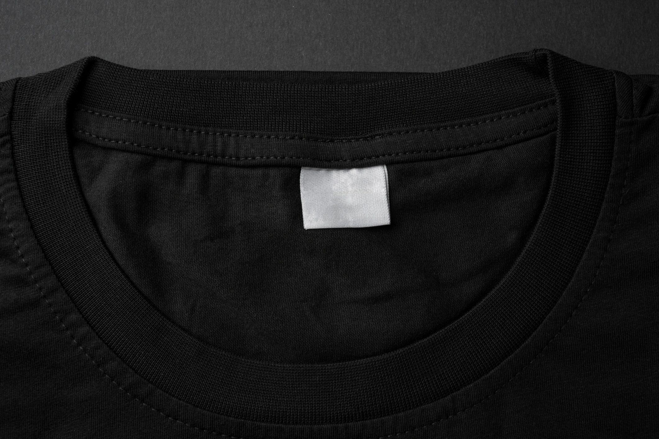 Close-up of a black t-shirt collar and label