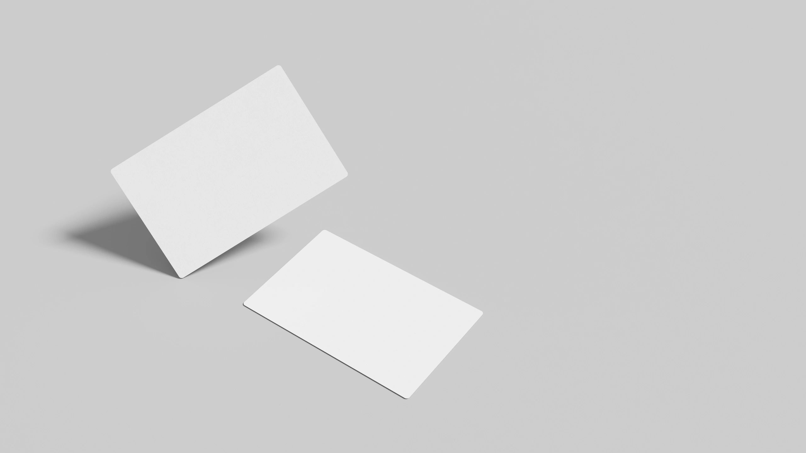 Minimal business card mockup on light grey background with negative space.
